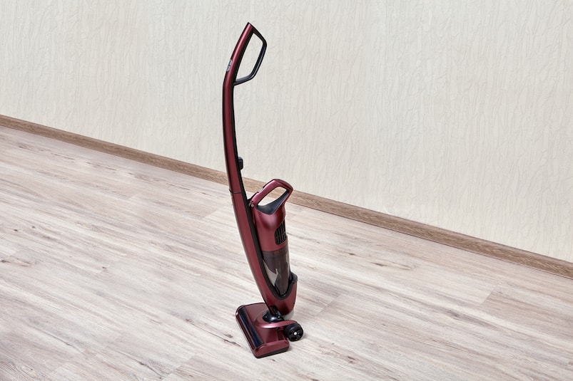 What surfaces does an upright vacuum work best on?